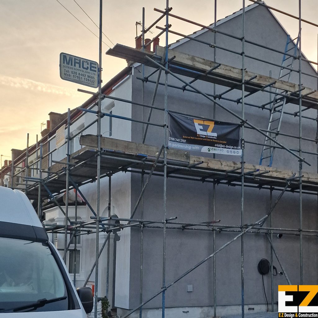 Solid wall insulation project Bexley showing finished side elevation and primed front ready for topcoat