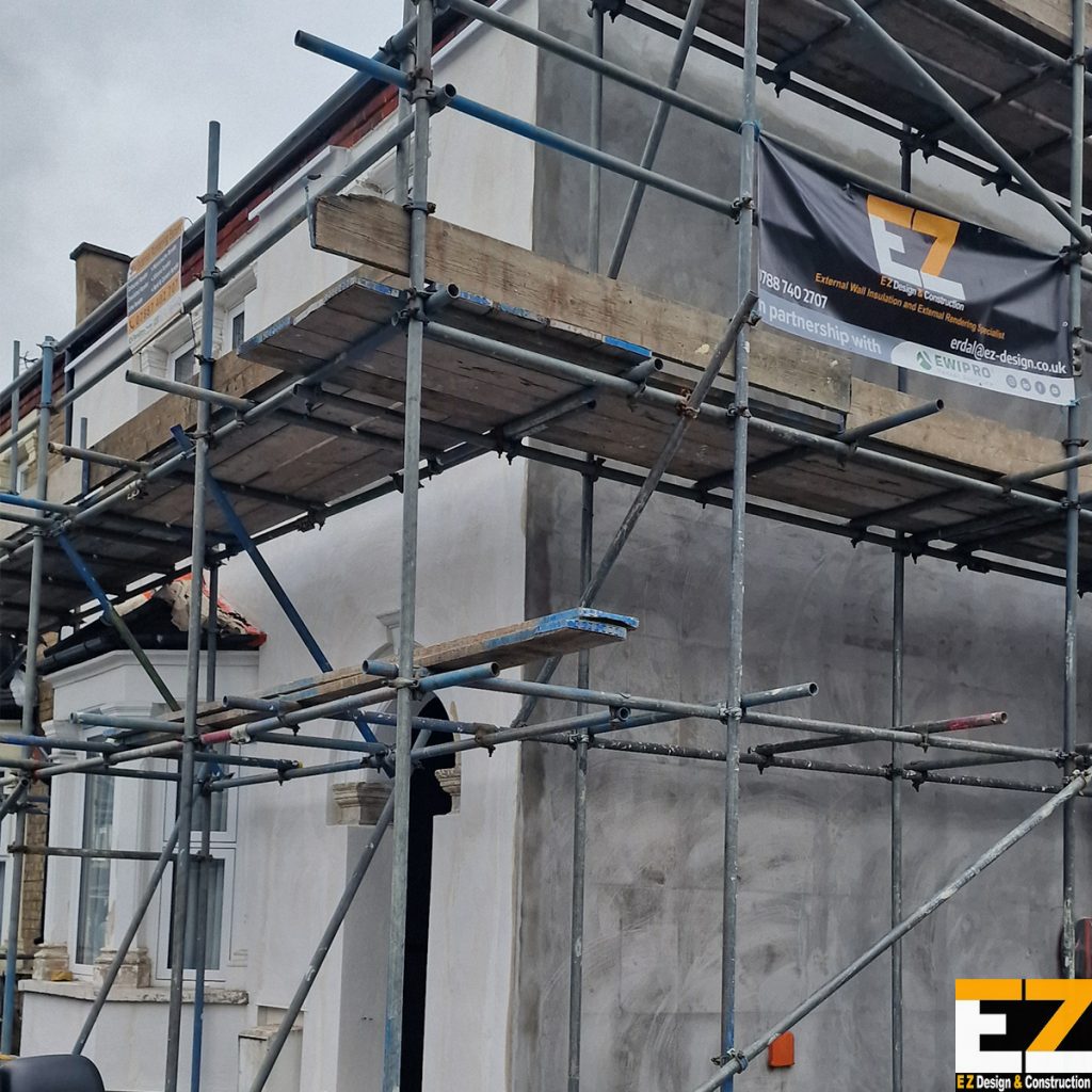 External wall insulation Bexley documentation showing reinforced basecoat application stage