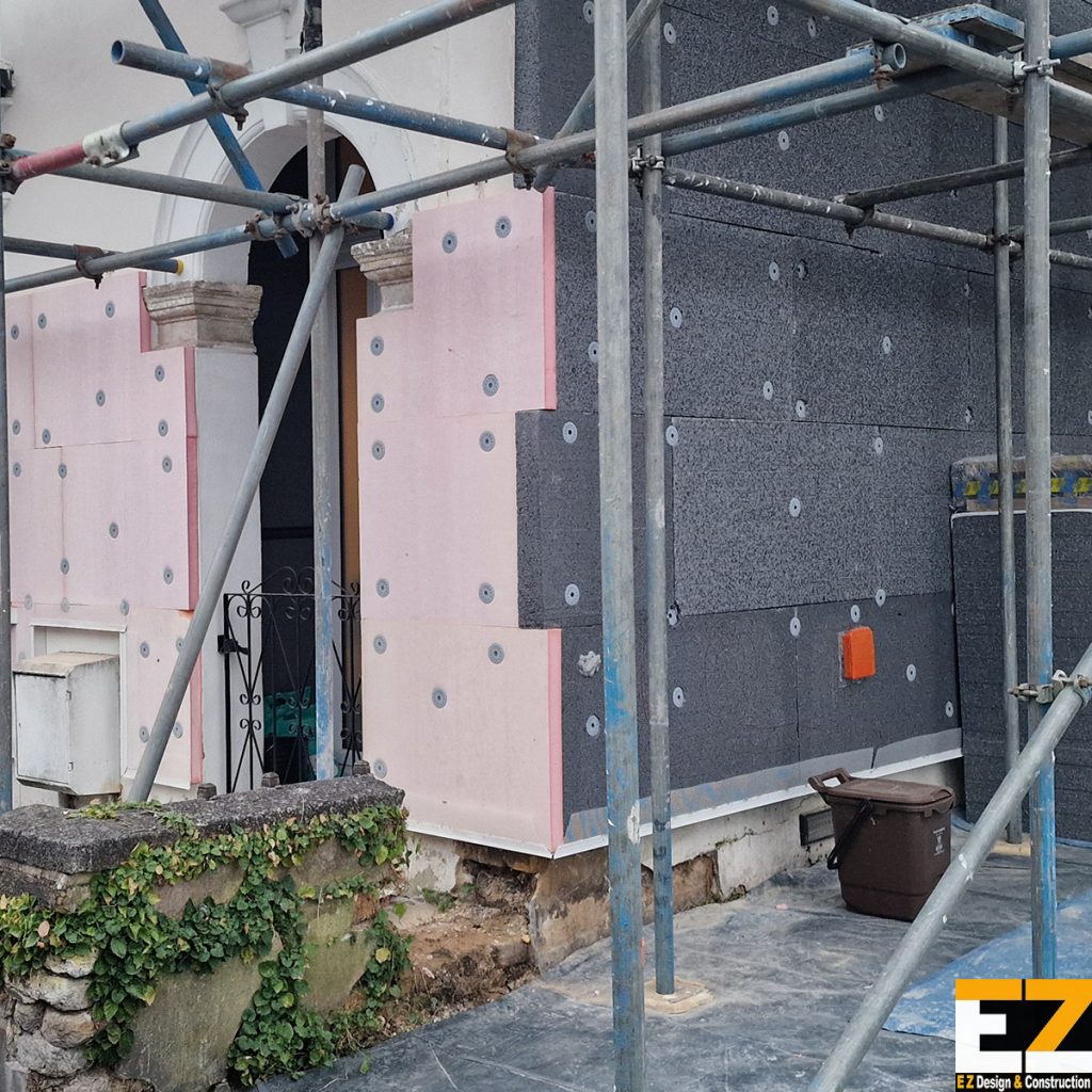 Solid wall insulation installers in Bexley fixing EPS and Kingspan Kooltherm K5 boards during installation