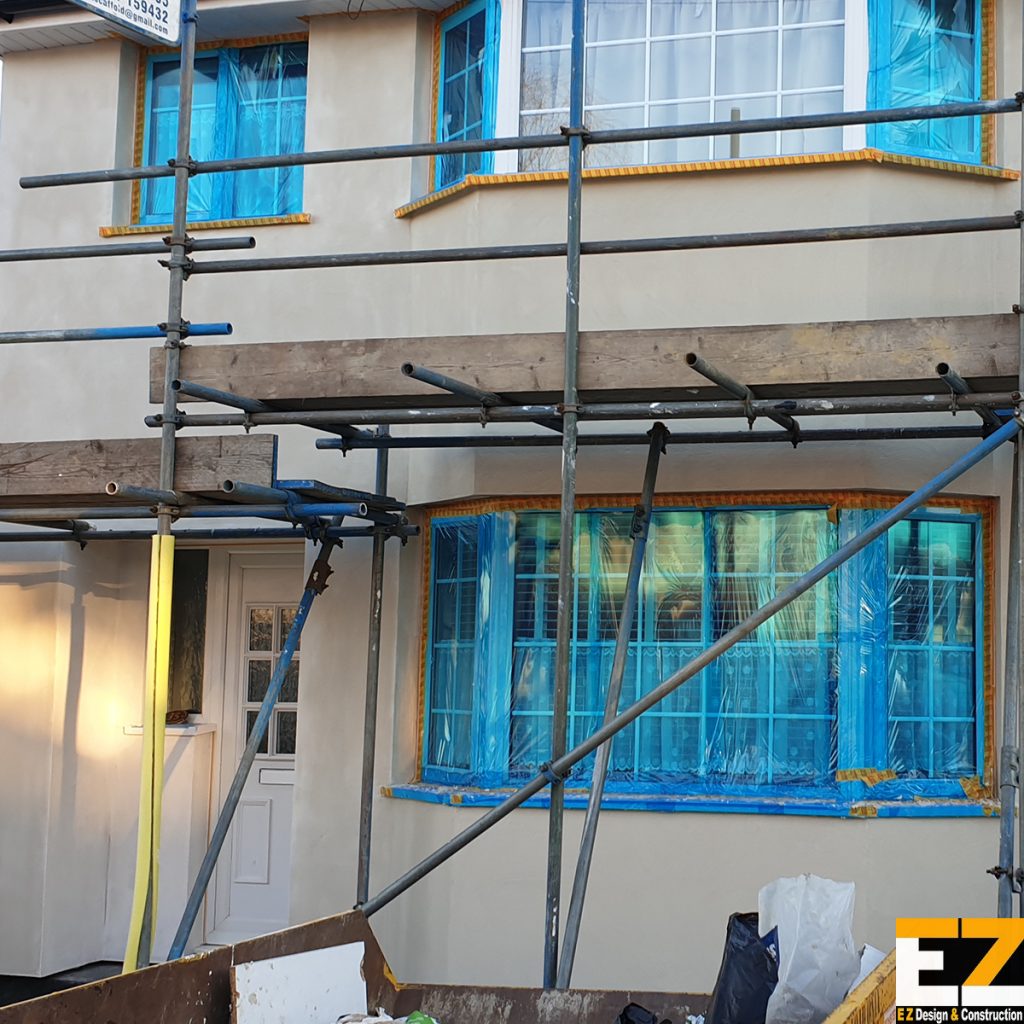 External Wall Insulation Sidcup at primer stage with basecoat complete and windows protected ready for silicone topcoat