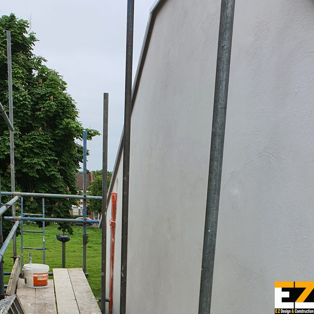 Mineral wool external wall insulation - Sundridge Bromley basecoat stage with scaffold in