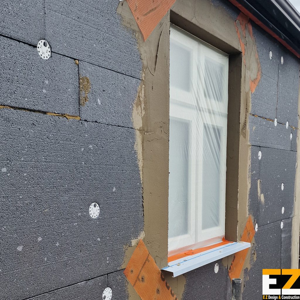 External Wall Insulation Swanley BR8 diagonal stress patches at window corners with corner beads and extended over-sill detail